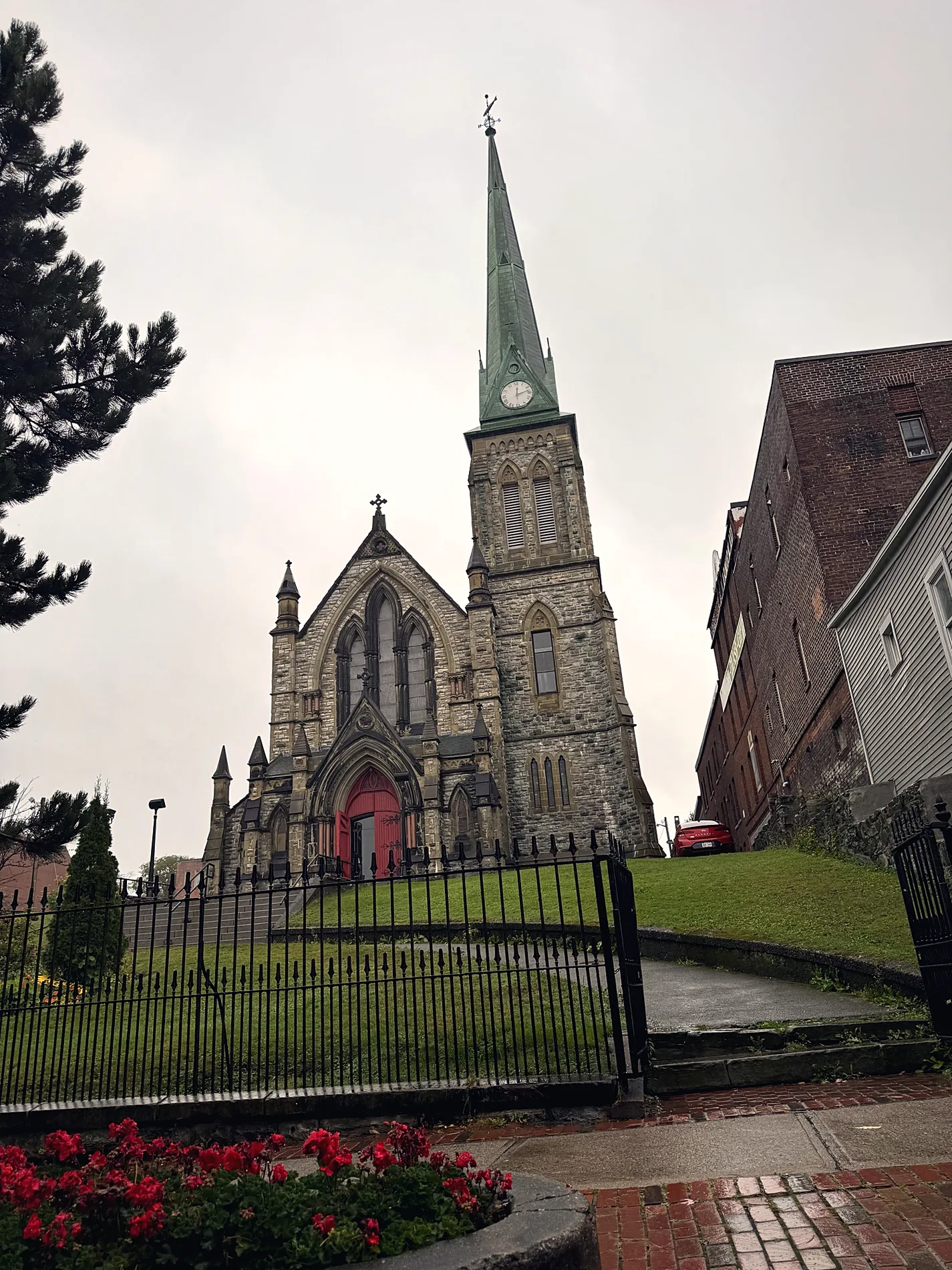 Stone church with a tall spire in uptown Saint John